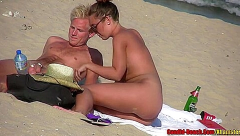 Sexy Nudist Couple Tanning On The Beach. Good Quality!